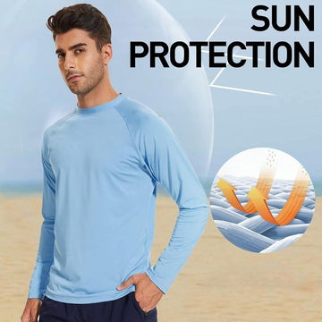 Man wearing light blue sun protection long sleeve shirt on beach with UV protection graphic